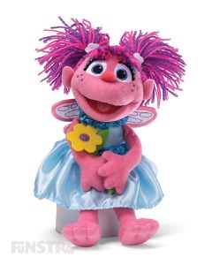 The lovable and huggable Abby Cadabby doll from the Sesame Street GUND plushy collection is holding a yellow flower, and will surely brighten any day!