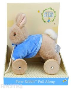 A Peter Rabbit stuffed toy is attached to a set of wheels with a rope attached for children to pull along and take their friend along with them.