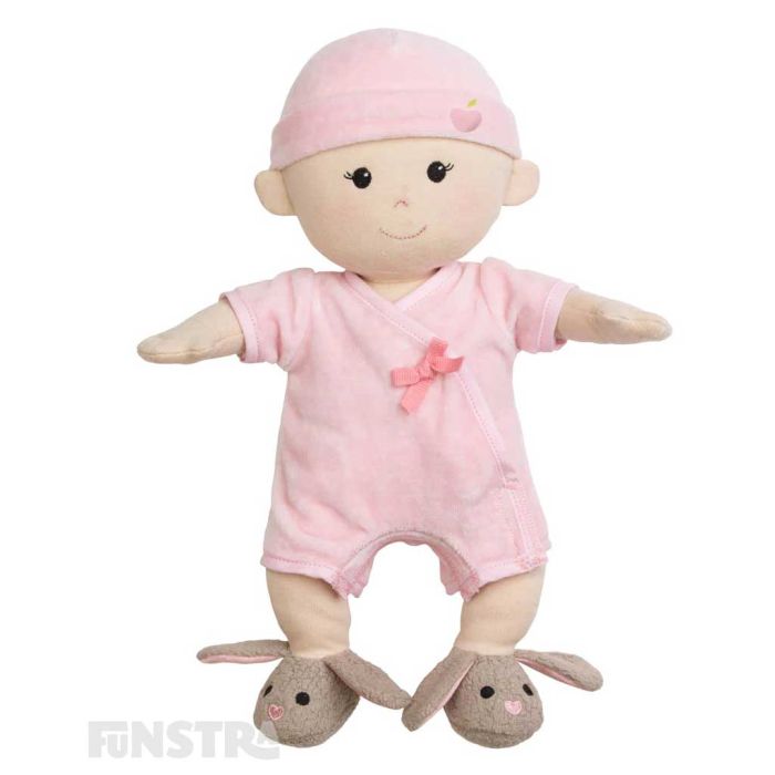 Apple Park's organic girl baby doll wears a pink onesie, bunny rabbit bootie shoes, a hat and features beautifully embroidered eyes, nose, and smile and hand-painted rosy cheeks.