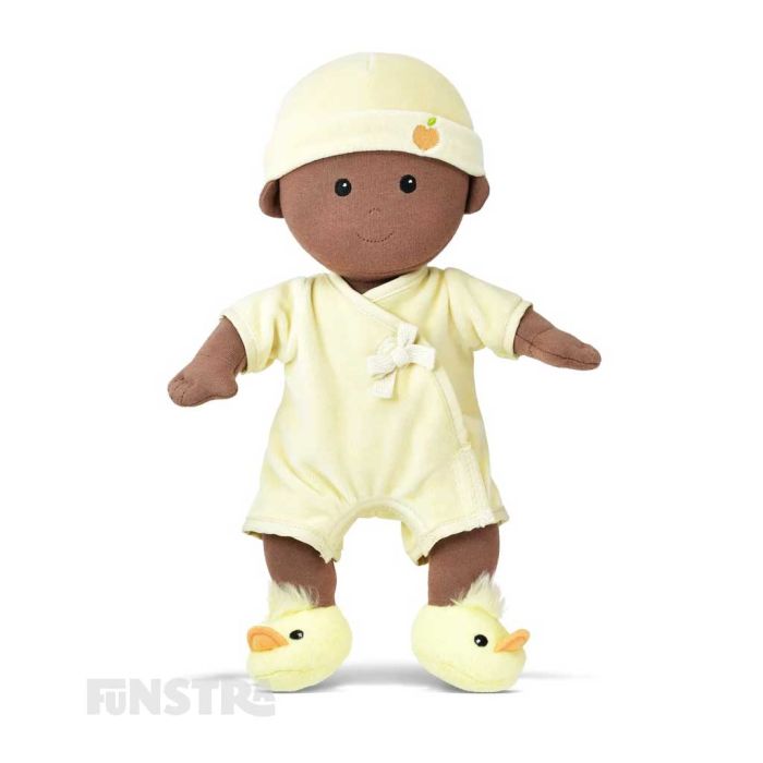 Apple Park's organic baby doll wears a cream onesie, duck bootie shoes, a hat and features beautifully embroidered eyes, nose, and smile and hand-painted rosy cheeks.