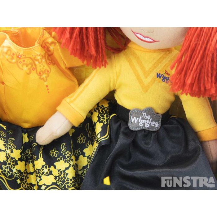 Wearing her yellow skivvy and black skirt, the doll even wears the official belt buckle