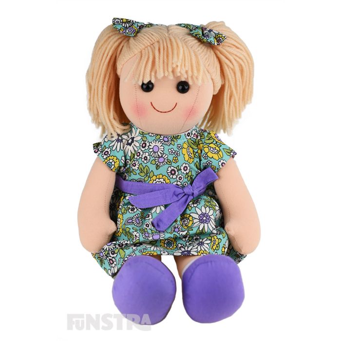 Grace is a sweet doll with a soft cloth body and blonde hair tied in pigtails with floral bows and wears a matching floral dress embellished with purple bow. Grace is a sweet doll with a soft cloth body and blonde hair tied in pigtails with floral bows and wears a matching floral dress embellished with purple bow.