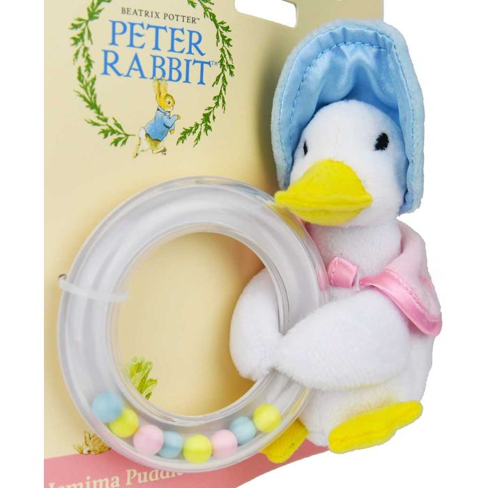 Jemima holds a ring rattle filled with tiny pink, yellow and blue balls that create a soft sound to entertain baby when shaken.