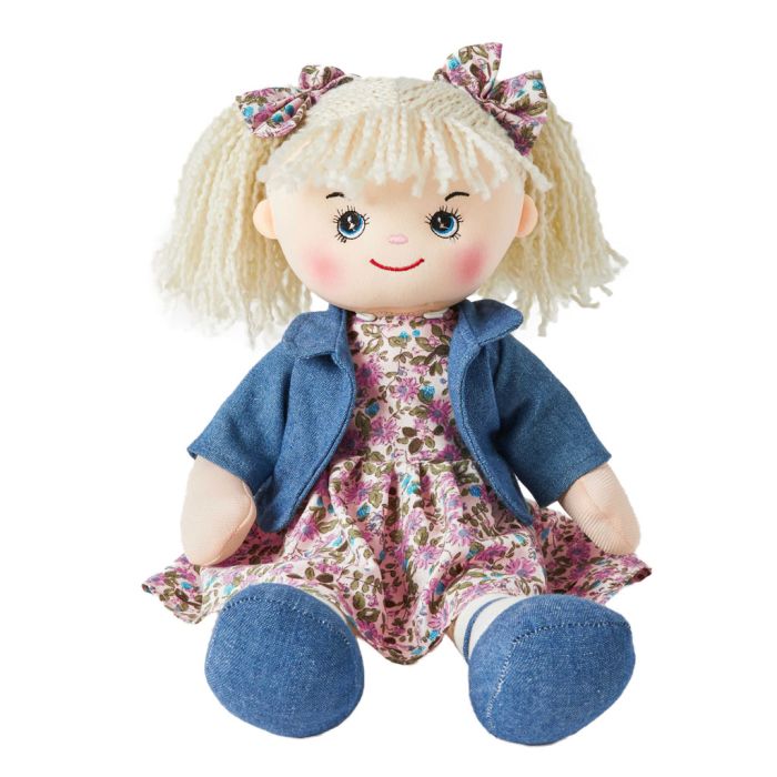 Freya is a super stylish rag doll with a soft cloth body and curly ringlet hair tied in pigtails with bows and wears a pink floral dress with a cute denim jacket and loves to bake and go swimming.
