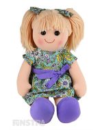 Grace is a sweet doll with a soft cloth body and blonde hair tied in pigtails with floral bows and wears a matching floral dress embellished with purple bow.