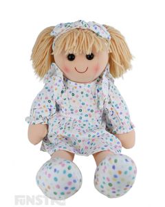 Elise is an gorgeous doll with a soft cloth body and blonde hair tied back in pigtails and wears a confetti-like pastel spotted printed dress and a matching headband.