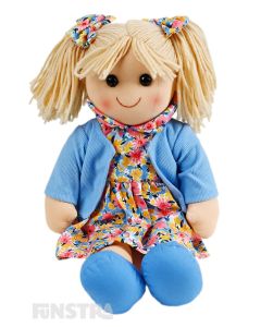 Harriet is a darling doll with a soft cloth body with blonde hair tied in pigtails secured with little bows and wears a floral print dress and blue jacket.