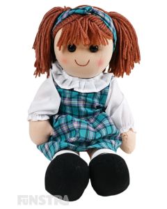 Margot is an endearing doll with a soft cloth body with auburn hair tied in with a headband and wears a classic schoolgirl style plaid print dress with a white blouse.