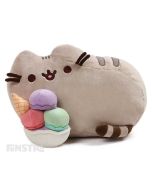 Pusheen is snacking on a huge, colorful ice cream sundae complete with an ice cream cone. The snack-loving cat loves to go on adventures with friends like Sloth, Stormy, Pip and Cheek in her popular webcomic with over 10 million social media fans.