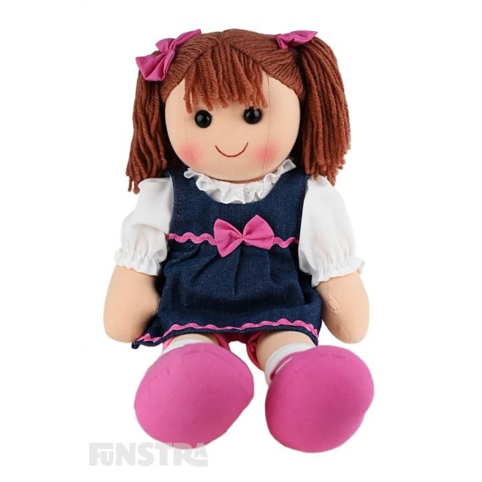 Lacey is a funky doll with a soft cloth body and brown hair tied in pigtails with pink bows and wears a denim dress embellished with pink ribbon and a bow over a white shirt and pink bike shorts. Lacey is a funky doll with a soft cloth body and brown hair tied in pigtails with pink bows and wears a denim dress embellished with pink ribbon and a bow over a white shirt and pink bike shorts.